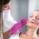 Sculptra being injected into cheek to restore volume