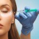 Woman receiving under-eye filler for hollow tear troughs