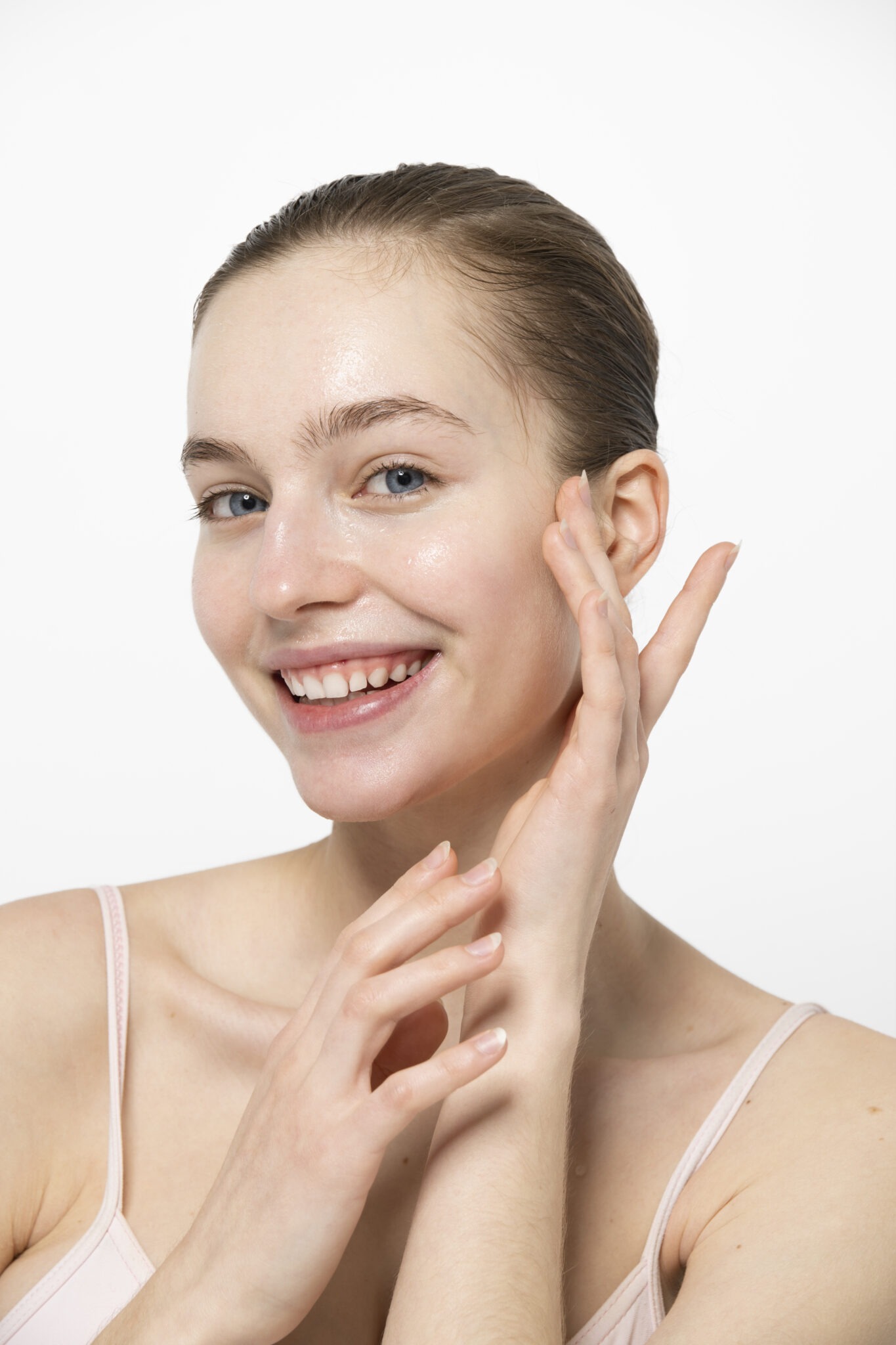 Smiling woman with plump, youthful skin after Sculptra