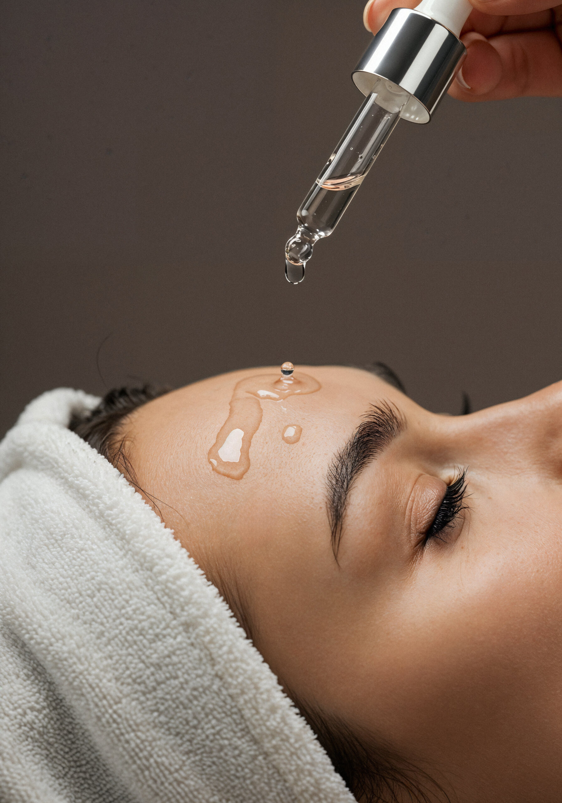 Collagen therapy serum applied to face