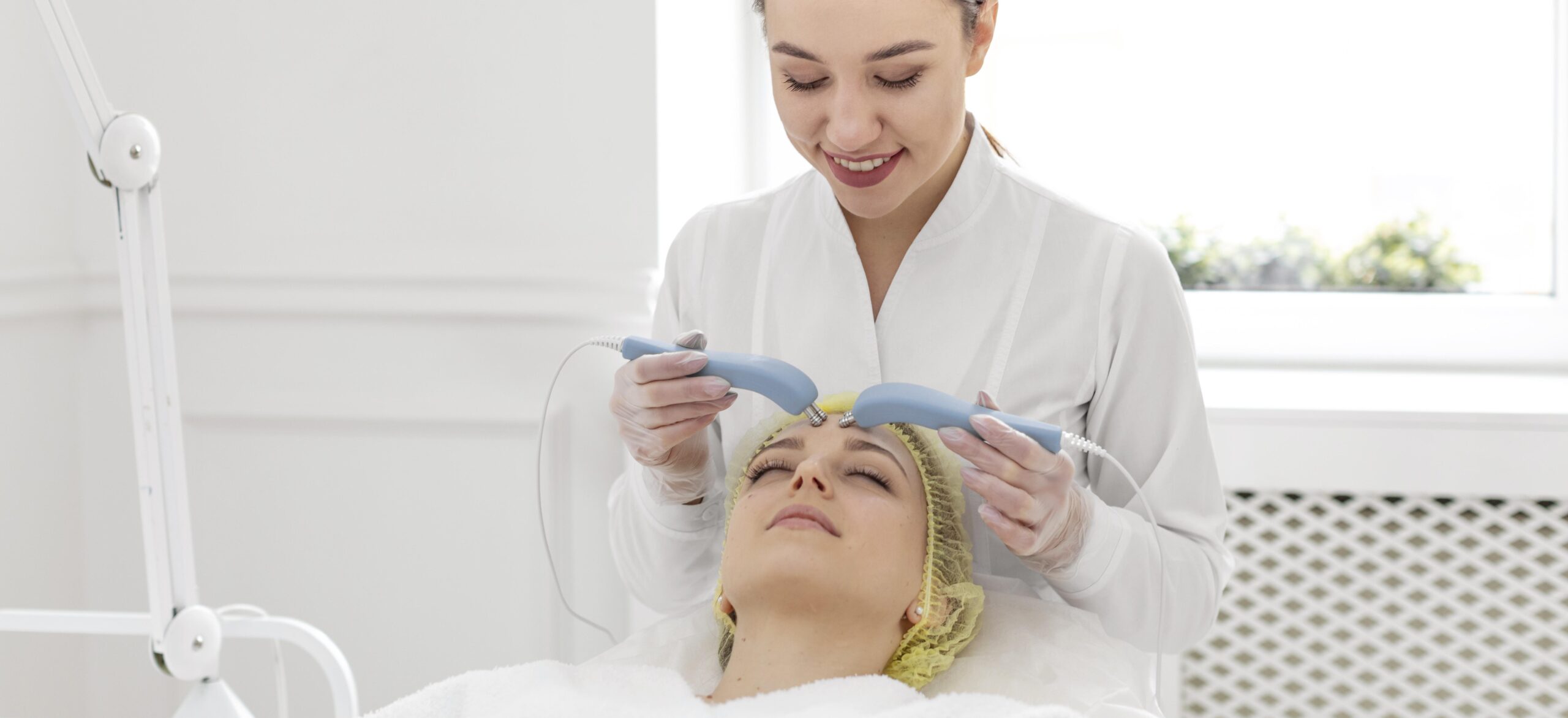 Woman receiving non-invasive facial treatment