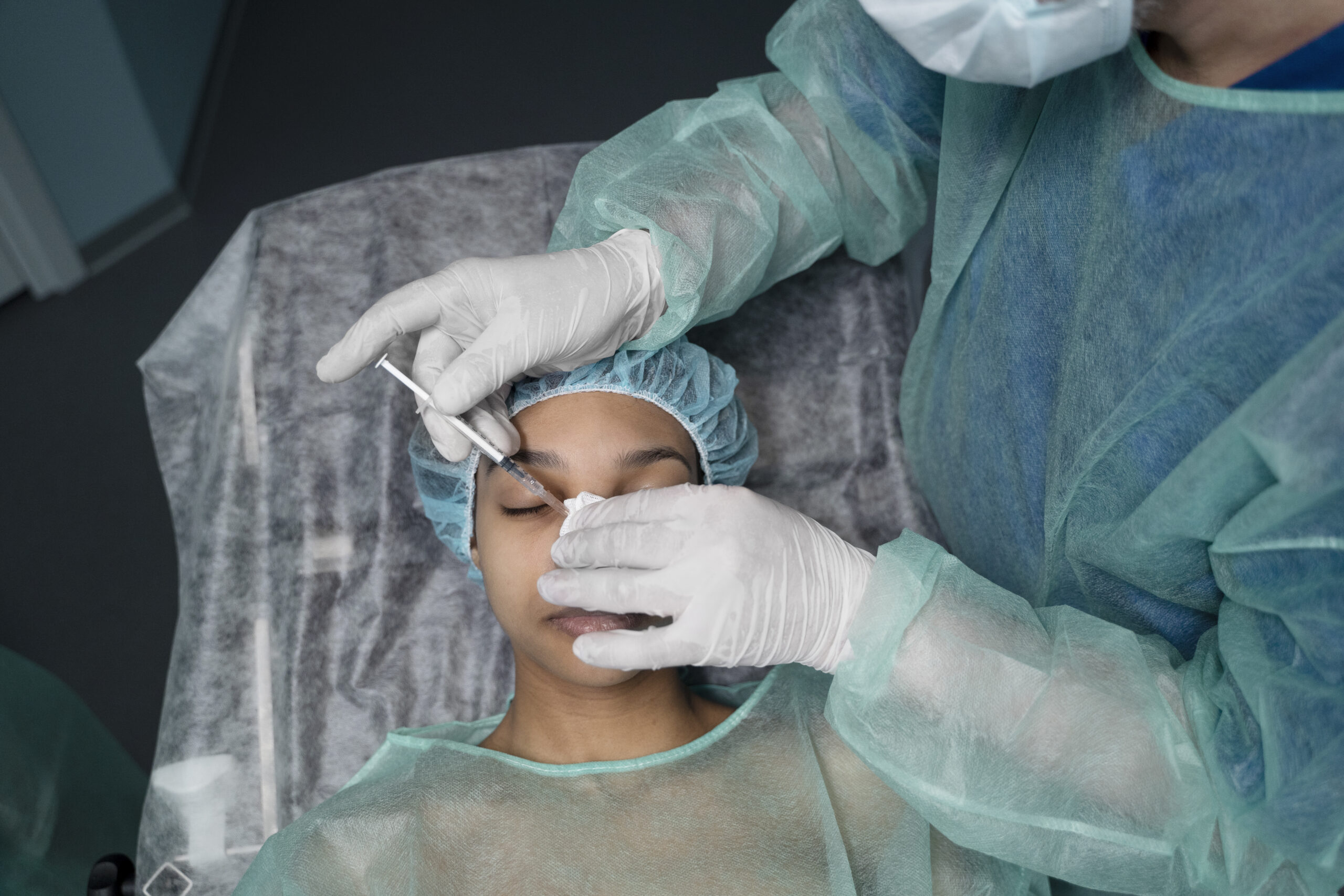 Dr Saud Al-Obaida performing liquid rhinoplasty at Reveal Clinics Riyadh