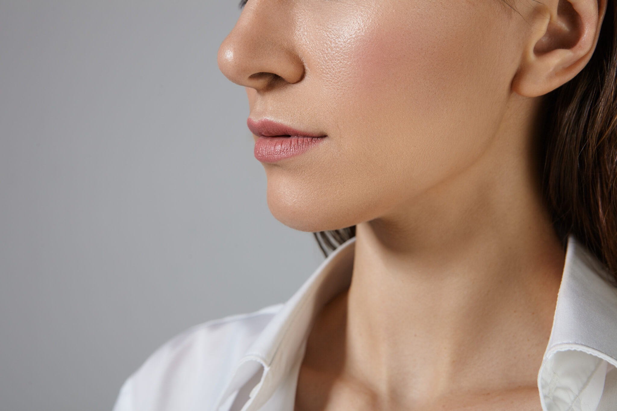Woman with sculpted chin and defined jawline